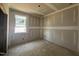 Awaiting finishing touches, bedroom with a window, primed walls, and bare floors at 246 Norman Ave, Lillington, NC 27546
