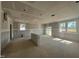 Large living room under construction, featuring drywall, bare floors, and several windows at 246 Norman Ave, Lillington, NC 27546