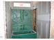 Bathroom with a green bathtub and construction visible, ready for finishing at 25 Autumnwood Ln, Spring Hope, NC 27882