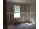 Bedroom showing the construction stage and a large window at 25 Autumnwood Ln, Spring Hope, NC 27882