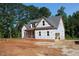 Exterior of a new construction home featuring gray roof, and an attached garage at 25 Autumnwood Ln, Spring Hope, NC 27882