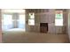 Large living room showing the construction, featuring a fireplace and ample light at 25 Autumnwood Ln, Spring Hope, NC 27882