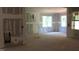 Spacious living room featuring natural light from the windows and an open floor plan at 25 Autumnwood Ln, Spring Hope, NC 27882