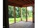 Unfinished back porch with wooden floor and framing overlooking green trees at 25 Autumnwood Ln, Spring Hope, NC 27882