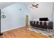 Large bonus room with wood floors, vaulted ceiling, comfortable seating, and flat screen TV at 255 Morris Rd, Pittsboro, NC 27312