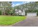 Charming home with well-manicured lawn and a detached two-car garage at 255 Morris Rd, Pittsboro, NC 27312