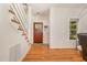 Bright foyer with hardwood floors, stairs, and a stylish front door at 255 Morris Rd, Pittsboro, NC 27312