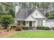 Charming home with a cozy front porch and landscaped garden at 255 Morris Rd, Pittsboro, NC 27312