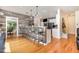 An open kitchen features wooden accents, stainless steel appliances, and a cozy breakfast bar at 255 Morris Rd, Pittsboro, NC 27312