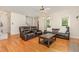 Comfortable living room with hardwood floors, ceiling fan, and stylish furniture at 255 Morris Rd, Pittsboro, NC 27312