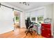 Bright office space with a sliding barn door, hardwood floors and natural light at 255 Morris Rd, Pittsboro, NC 27312