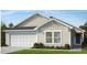 Charming one-story home with neutral siding, white trim, a two-car garage, and well-maintained landscaping at 256 Norman Ave, Lillington, NC 27546