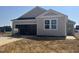 One-story home with gray siding and white trim, and a two-car garage under construction at 256 Norman Ave, Lillington, NC 27546