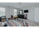 This bedroom features light walls, carpet, a ceiling fan, and two windows at 2586 Lacey Holt Rd, Graham, NC 27253