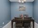 Dining room with seating for four, a chandelier and The Last Supper artwork on wall at 2586 Lacey Holt Rd, Graham, NC 27253