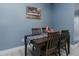 Dining room with seating for four, a striped runner, and The Last Supper artwork on wall at 2586 Lacey Holt Rd, Graham, NC 27253