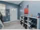 Neat entryway featuring shoe storage and stylish decor at 2586 Lacey Holt Rd, Graham, NC 27253