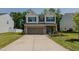 Charming two-story home with a well-maintained lawn and a two-car garage at 2586 Lacey Holt Rd, Graham, NC 27253