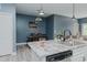 Eat-in kitchen area with pendant lights, granite countertops, and stainless dishwasher at 2586 Lacey Holt Rd, Graham, NC 27253