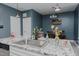 Eat-in kitchen area with pendant lights, granite countertops, and stainless dishwasher at 2586 Lacey Holt Rd, Graham, NC 27253