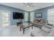 Living room with hardwood floors, ceiling fan, and plenty of natural light at 2586 Lacey Holt Rd, Graham, NC 27253