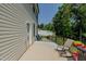 Back patio with outdoor seating, a grill, and a view of the backyard at 2586 Lacey Holt Rd, Graham, NC 27253