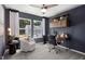 A cozy, carpeted bedroom has two windows and a built-in shelving desk unit at 2799 Cassius Dr, Apex, NC 27502