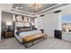 Inviting main bedroom with tray ceiling, soft carpet, large windows, and stylish decor at 2799 Cassius Dr, Apex, NC 27502