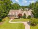 Expansive aerial view showcasing a home's lush green lawn, inviting walkway, and a detached garage at 2945 Chimney Hill Trl, Rocky Mount, NC 27804