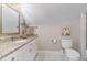 Small bathroom features a granite countertop, decorative mirror and tile flooring at 2945 Chimney Hill Trl, Rocky Mount, NC 27804
