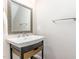 Modern bathroom featuring a stylish vanity with storage and a framed mirror and silver tap hardware at 2945 Chimney Hill Trl, Rocky Mount, NC 27804