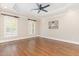 Spacious primary bedroom featuring hardwood floors, tray ceiling, and lots of natural light at 2945 Chimney Hill Trl, Rocky Mount, NC 27804