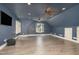 Finished bonus room with dark-blue walls, recessed lighting, and laminate wood floor at 2945 Chimney Hill Trl, Rocky Mount, NC 27804