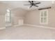 Bonus room with carpet, ceiling fan, window nook, built in drawers and unique architecture at 2945 Chimney Hill Trl, Rocky Mount, NC 27804