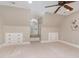 Bonus room with carpet, a ceiling fan, and unique built in drawers and window nook at 2945 Chimney Hill Trl, Rocky Mount, NC 27804