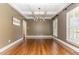 Hardwood floors and coffered ceiling create an elegant dining room, with an abundance of natural light at 2945 Chimney Hill Trl, Rocky Mount, NC 27804