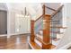 Elegant foyer featuring hardwood floors, a staircase with iron railings, and a bright entryway at 2945 Chimney Hill Trl, Rocky Mount, NC 27804