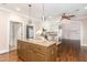 Spacious kitchen with stainless appliances, granite countertops, and a large island with pendant lighting at 2945 Chimney Hill Trl, Rocky Mount, NC 27804