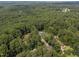Overhead shot of a home and surrounding verdant landscape, creating a tranquil and private atmosphere at 308 Fleming Dr, Durham, NC 27712