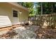Back door and brick patio enclosed with wood fence at 308 Fleming Dr, Durham, NC 27712