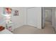Well-lit bedroom features neutral carpet, a full bed and closet space at 308 Fleming Dr, Durham, NC 27712