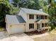 Charming two-story home with a well-manicured lawn, attached garage, and inviting front porch at 308 Fleming Dr, Durham, NC 27712