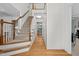 Spacious foyer features hardwood floors, a carpeted staircase, and ample natural light at 308 Fleming Dr, Durham, NC 27712