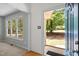 Light-filled foyer showcases a beautiful view of the outdoors through a large open doorway at 308 Fleming Dr, Durham, NC 27712