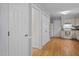 Bright kitchen features wooden floors, white cabinets, and appliances at 308 Fleming Dr, Durham, NC 27712