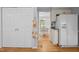 Open-concept kitchen with hardwood floors leads to a dining area, offering seamless flow at 308 Fleming Dr, Durham, NC 27712