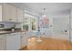 Charming kitchen featuring a breakfast nook with bright natural light and hardwood floors at 308 Fleming Dr, Durham, NC 27712
