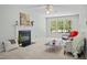 Inviting living room with cozy fireplace and large window overlooking the backyard at 308 Fleming Dr, Durham, NC 27712