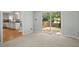 View from living room to kitchen and a sliding glass door to the deck at 308 Fleming Dr, Durham, NC 27712