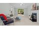 The living room features neutral walls, a fireplace and a large window at 308 Fleming Dr, Durham, NC 27712